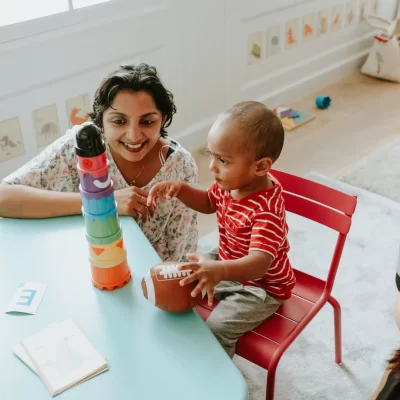 child-playing-with-a-teacher-in-the-nursery